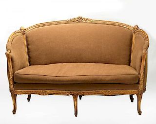 A CIRCA 1900 LOUIS XVI CARVED AND GILDED SOFA