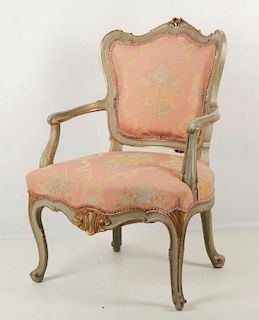 A FRENCH STYLE FAUTEUIL PAINTED GREEN AND GOLD