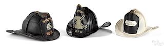 Two leather fire helmets