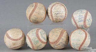 Seven team signed baseballs