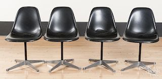 Four Eames office chairs