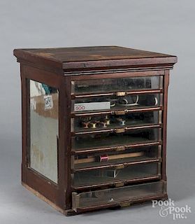 Spool cabinet, with seven glass front drawers
