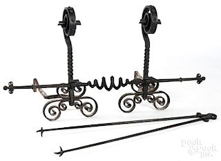 Pair of Arts and Crafts iron andirons, 27'' h.