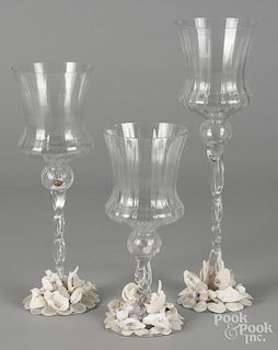 Three oversize colorless glass goblets
