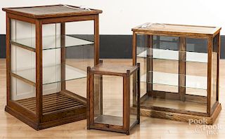 Three glass and oak display cases