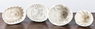 Four white Ironstone molds, to include an eagle.