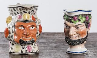 Two Staffordshire satyre pitchers