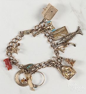 Gold charm bracelet, most pieces marked 14K