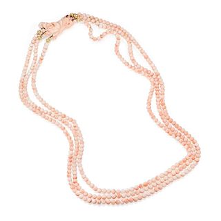 A Three Strand Angel Skin Coral Bead Necklace