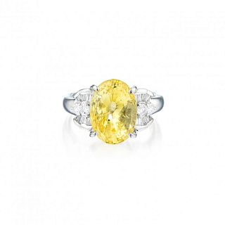 A Yellow Sapphire and Diamond Ring