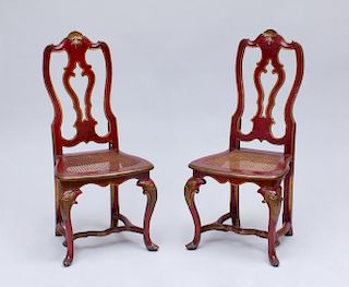PAIR OF ITALIAN ROCOCO RED PAINTED, PARCEL-GILT AND CANED SIDE CHAIRS