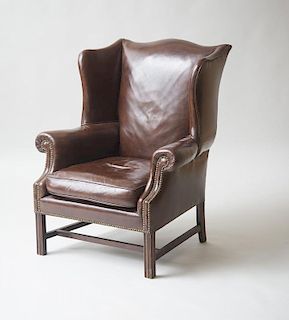 GEORGE III STYLE MAHOGANY AND LEATHER UPHOLSTERED WING ARMCHAIR