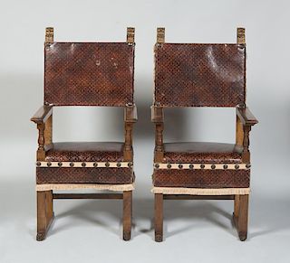 PAIR OF SPANISH BAROQUE STYLE WALNUT AND PARCEL-GILT HALL CHAIRS