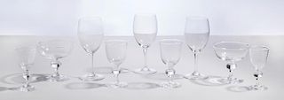SET OF NINE STEUBEN GLASS CHAMPAGNE COUPES, FOUR MATCHING CORDIALS, FOUR MATCHING SHERRIES AND SEVEN BACCARAT RED WINE GLASSE