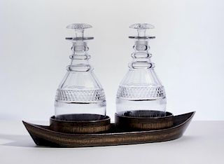 PAIR OF CUT-GLASS DECANTERS AND STOPPERS WITH A PAINTED WOOD STAND