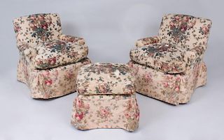 PAIR OF TEA STAINED LINEN CHINTZ UPHOLSTERED CLUB CHAIRS AND MATCHING OTTOMAN