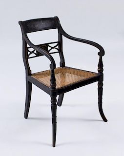 REGENCY STYLE EBONIZED AND POLYCHROME PAINTED AND CANED ARMCHAIR