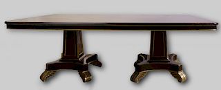 REGENCY STYLE CARVED MAHOGANY AND PARCEL-GILT TWIN PEDESTAL TABLE