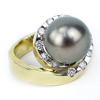Approx. .65 Round Brilliant Cut Diamond, 11mm Tahitian Black Pearl, 14 Karat Yellow Gold Retro Style Ring.