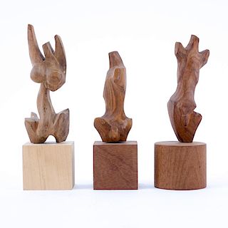Three Mid-Century Carved Wood Figural Sculptures.