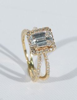 14 karat gold engagement ring set with emerald cut diamond approximately 1.0cts.-1.35cts., surrounded by small diamonds. size