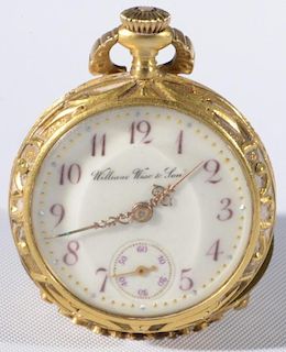 William Wise & Son 18 karat gold lapel watch having wreaths, carved pierced back mounted with three diamonds and blue stones