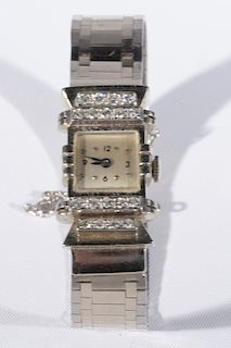 14 karat white gold Art Deco ladies square wrist watch with 14 karat link band, mounted with eighteen diamonds, back engraved