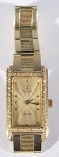 Ladies 14 karat yellow Vincenze quartz wristwatch with 12mm wide 14 karat yellow gold bracelet attached, the case contains fi