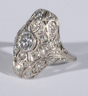 Platinum ladies ring set with center diamond in filigree type setting mounted with multiple diamonds, center diamond approxim