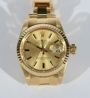 18 karat gold Rolex Oyster Perpetual Date Just ladies wristwatch in like new condition being sold with original boxes, tag, b
