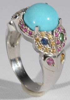 Ladies 14 karat white gold Levian ring containing one prong set 11mm round cabochon turquoise, the setting contains multiple