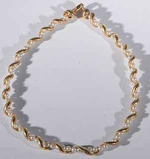 Tiffany & Co. 14 karat gold and pearl necklace having string of pearls overwound with gold. lg. 16in.