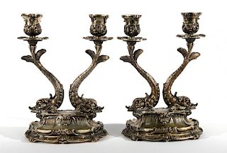 Pair of Mario Buccellati Italian silver two-light candelabra having oval base and two dolphin form supports, each marked unde