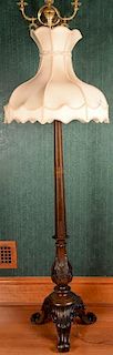 Victorian style carved walnut floor lamp with custom silk shade. ht. 69in. Provenance: Property from the Estate of Frank Perr