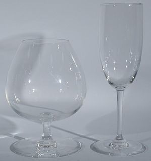Group of thirty-five Baccarat crystal glasses including a set of eleven brandy stems and twenty-four champagne flutes. stems: