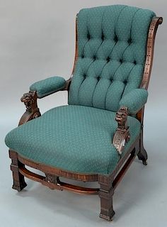 Victorian walnut reclining gentlemans chair with carved lion hand rests. ht. 39in. Provenance: Property from the Estate of Fr