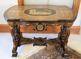 Renaissance Revival center table having shaped inlaid top, scene with girl, donkey, dog, and goose surrounded by various wood