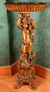 Victorian style fern stand with shell shaped bowl on cherub figure on carved stand, 20th century. ht. 51in., wd. 23in. Proven