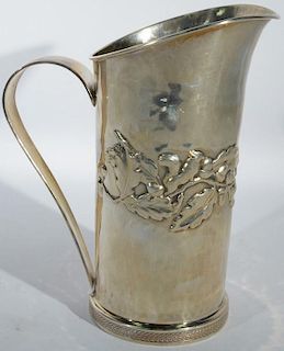 Sterling silver pitcher with oak leaf design. ht. 8 1/2in., 18.6 troy ounces