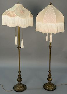 Pair of metal floor lamps with custom silk shades.  ht. 67in., dia. 20in.  Provenance: Property from the Estate of Frank Perr