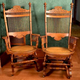 Pair of oak platform rockers with leather seats. ht. 45in. Provenance: Property from the Estate of Frank Perrotti Jr. of Hamd