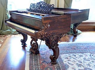 Steinway rosewood grand piano with scroll carvings and cabriole legs dated 1859.  lg. 103in.  Provenance: Property from the E