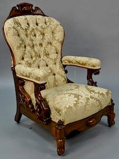 Rosewood Victorian reclining gentleman's chair having unusual open carved arm with tufted custom upholstery