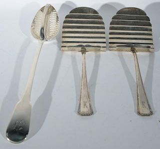 Three piece lot of silver including two Continental silver servers and one English silver strainer spoon (all monogrammed)