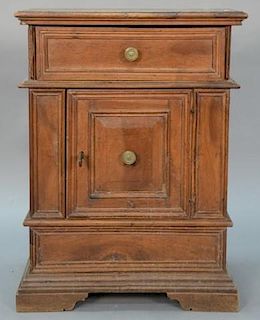 Continental walnut side cabinet having one drawer over single door set on plain molded base, probably Italian 18th century. h