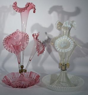 Two piece lot to include Victorian art glass light cranberry epergne having ruffle edge bowl with three jack and pulpit vases