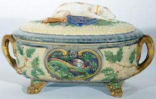 Minton Majolica covered tureen having basket weave body and cover with hunting dog finial and rabbit and pheasant panel on ea