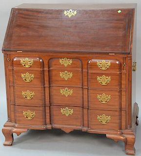 Margolis mahogany desk having slant lid over four block front drawers flanked by fluted columns all set on ogee feet, interio