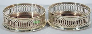 Pair of Tiffany & Co. sterling silver wine coasters with wood base. dia. 5in.