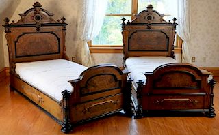 Pair of walnut and burl walnut Victorian twin beds. ht. 59 1/2in., interior: 36" x 75" Provenance: Property from the Estate o